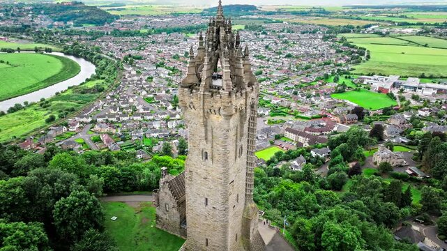 Aerial view of Elaborate Victorian stone tower in Scotland, United Kingdom. The National Wallace Monument, famous landmark on a hilltop overlooking Stirling in Scotland.