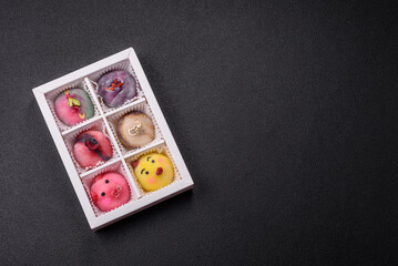 Delicious cold Japanese mochi dessert with colorful rice dough shell and fruit filling