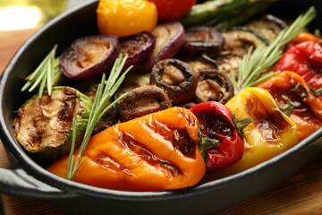 Delicious grilled vegetables in baking dish on table, closeup
