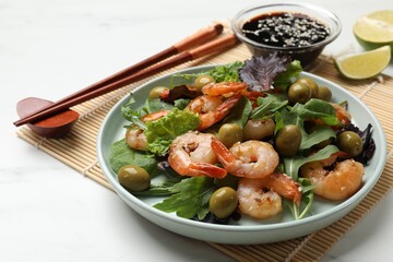 Delicious shrimp salad served on white table