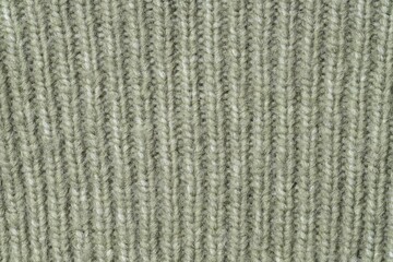Texture of olive knitted fabric as background, top view