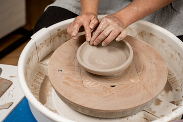 Ceramics workshop. Learning how to create a bowl using a pottery wheel. Modeling a shape of your own clay project. Improving skills in traditional pottery.