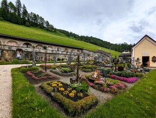 
Graves decorated with flowers in the cemetery of Sexten (Sesto), a small community in the...