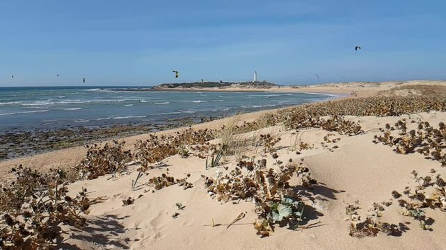 People kitesurfing a windy day on Los Ca&ntilde;os de Meca beach, a small seaside village to the east of Cape Trafalgar, Barbate town, Province of C&aacute;diz and the autonomous region of Andalusia, South Spain