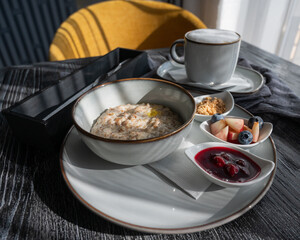 Porridge and coffee. Served breakfast in a cafe.