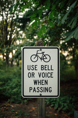 sign stating "Use bell or voice when passing" in Seattle's Interlaken Park