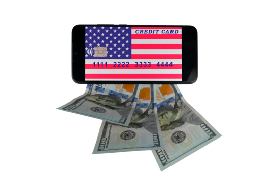 A smartphone with a credit card image in the form of the US flag lies on $100 bills (close-up on a transparent background). Paying with a credit card online for purchases in online stores