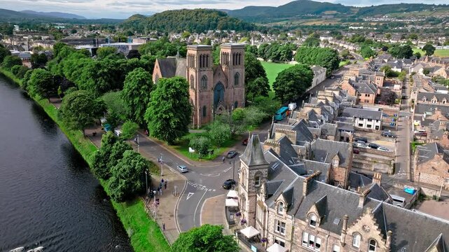 Aerial view of Inverness Cathedral church built of red stone and granite and hosting regular services. Drone view of Old Town on Scotland&rsquo;s northeast coast, where the River Ness meets the Moray Firth.