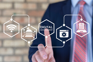 Businessman using virtual touch screen presses text: DIGITAL GOVERNMENT. Electronic government...
