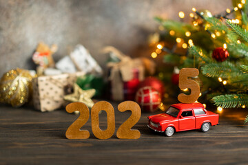 Wooden numbers 2025, toy car carries the number 5