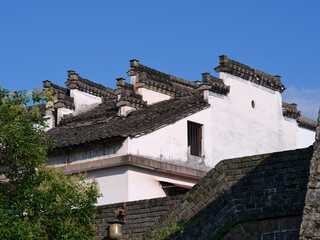 old chinese style houses with firewall beside city wall