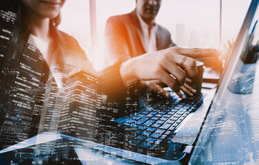 Double exposure image of business people group meeting on city office building in background showing partnership success of business deal. Concept of corporate teamwork, trust and work agreement. uds