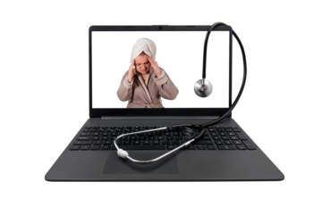 Laptop and medical stethoscope on a transparent background. On the laptop screen - a girl in a bathrobe clasped her head in her hands (headache)