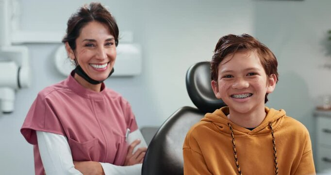 Face, smile or dentist with kid in clinic for oral care, tooth or brace implant. Portrait, orthodontics or happy child with doctor or confident pediatrician with arms crossed for dental health of boy