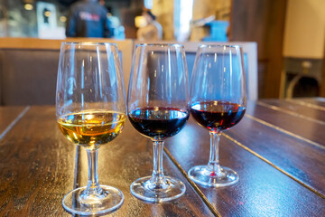 port wine testing, glasses with drink samples in bar