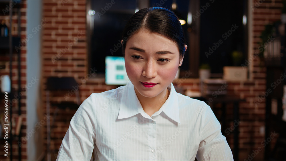 Aufkleber zoom in on smiling businesswoman inputting financial data on laptop and analyzing sales report to pl