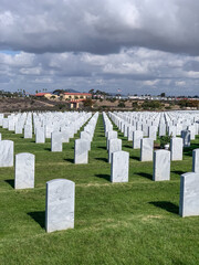 View of headstones in cemetery.
