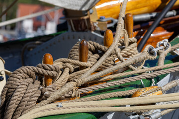 Nautical Ropes and Wooden Cleats on Boat Deck