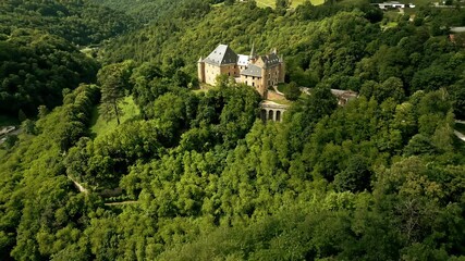 Aerial shot of Chateau d'Uriage, a historic castle in Saint-Martin-d'Uriage, an official monument in France.