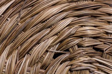 Macro photography of the intricate weave of a traditional basket  made in natural material.
