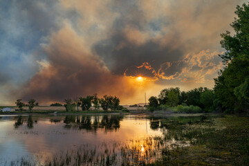 wildfire at Colorado foothills west of Loveland, smoke plume from Alexander Mountain fire as seen...