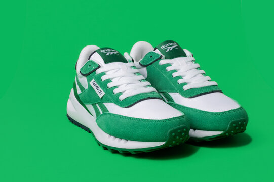 sports green reebok sneakers on a green background,