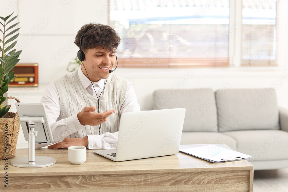 Canvas Prints male technical support agent with laptop working from home