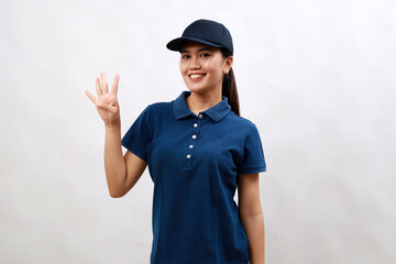 Young asian woman courier wearing delivery uniform and cap showing and pointing up with finger number four while smiling confident and happy.