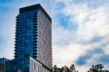 Fototapeta premium City architecture. Architecture of modern glass building. Perspective city skyscraper. Modern skyscraper building. Glass building in metropolis. Skyscraper perspective view. Copy space