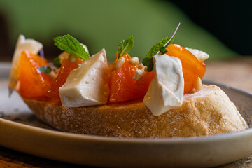 Gourmet Crostini with Brie Cheese, Persimmon, and Pine Nuts