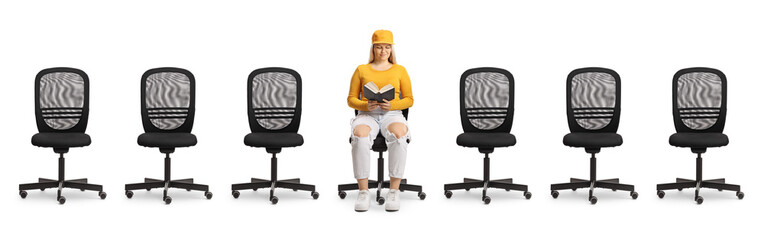 Office chairs and a young female reading a book