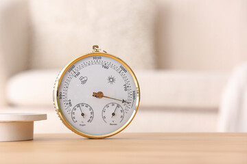 Aneroid barometer on table in room, closeup
