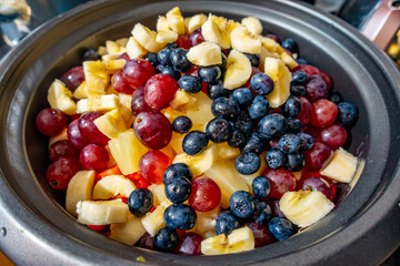 Chopped fruit in a bowl ready to make a fruit salad.