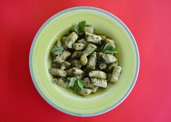 Gnocchi basil pesto on the table.