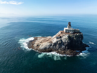 A deactivated lighthouse stands on Tillamook Rock off the rugged coast of northern Oregon....