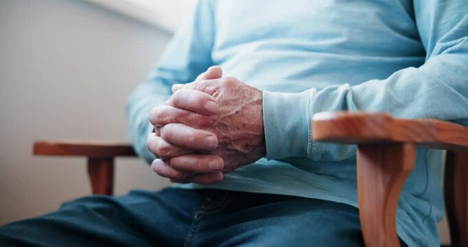 Senior person, closeup hands and stress for cancer diagnosis, mental health and overthinking in home. Elderly man, finger zoom and anxiety for test results, retirement crisis and chemotherapy outcome