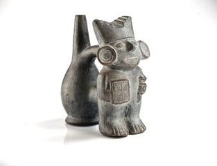 Ancient Peruvian ceramic figurine with intricate carvings