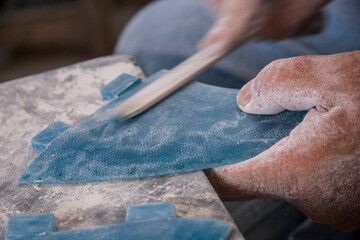 Artisan Crafting Surfboard Fins