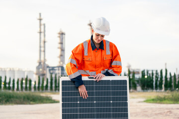 female worker engineer conducts site inspection at an industrial facility. An industrial engineer focuses on renewable energy, showcasing a solar panel against the backdrop of an industrial facility.