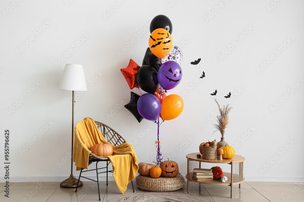 Wall mural Interior of living room with Halloween balloons, armchair and table