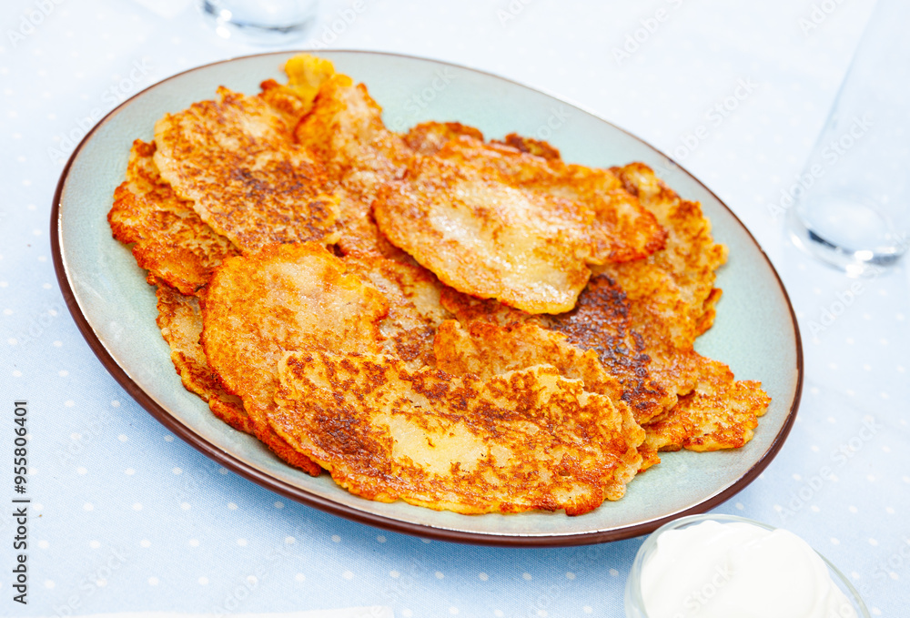 Sticker Potato pancakes with sour cream. Belorussian cuisine