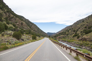 Road next to the Arkansas River flowing through Royal Gorge Canyon, Colorado