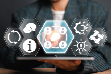 Businessman using a tablet with digital icons representing communication, networking, and information exchange in a modern business environment.
