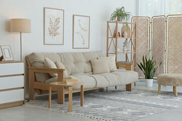Stylish living room with folding screen and sofa. Interior design