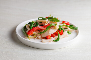 salad with squid, sweet bell pepper and arugula, with dressing, homemade, no people, Healthy eating concept