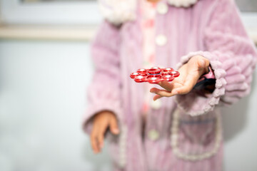 Close-up of a turntable toy in hand