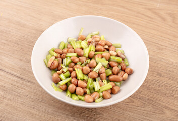 Peanuts with celery in dish