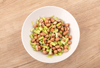 Peanuts with celery in dish
