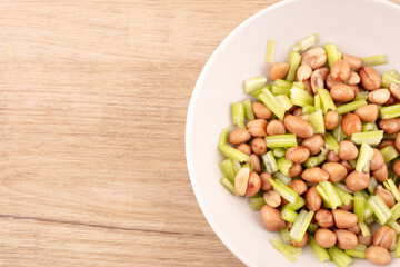 Peanuts with celery in dish