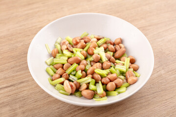 Peanuts with celery in dish